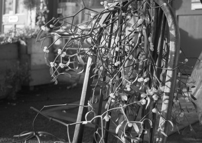 Mistletoe on the back of a chair outside a shop