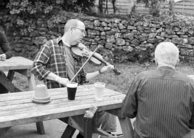 A pub session starts outside the pub in Priddy durring the festival