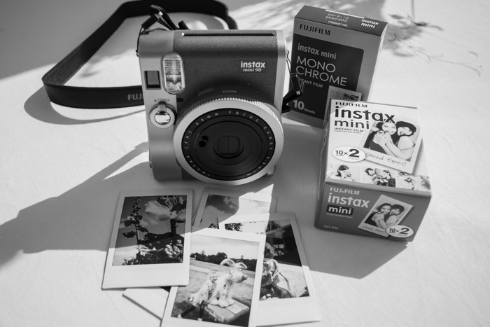 Instax Mini 90 camera with film packs plus example photographs