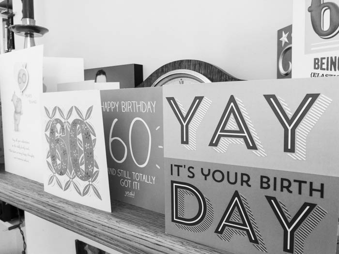 Sixtieth birthday cards on a shelf