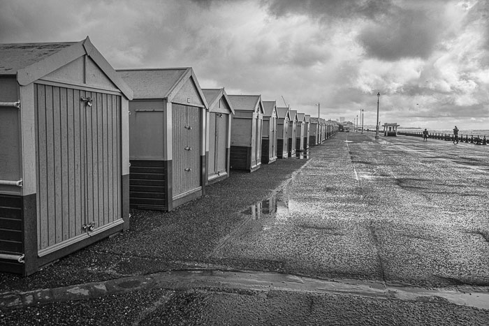 Portslade beach huts during a storm